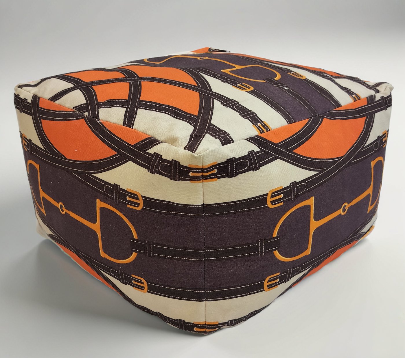 interwoven belts and buckles canvas pouffe